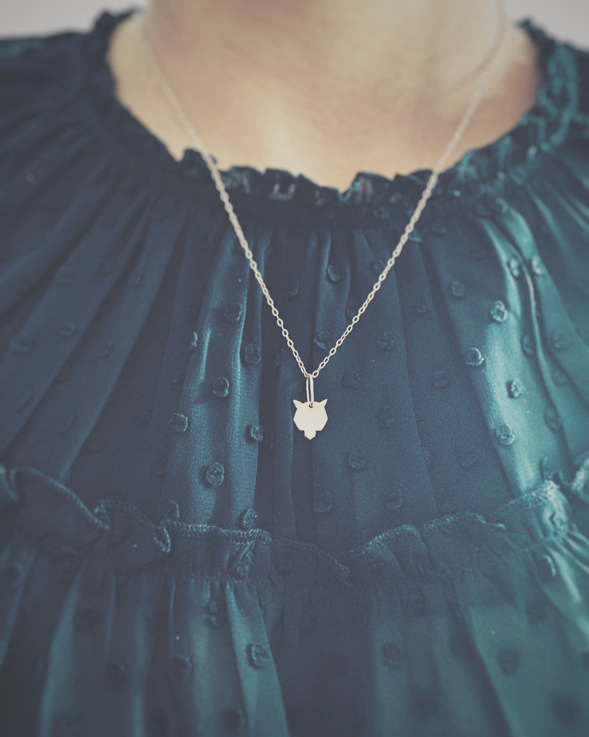 long gold wolf necklace