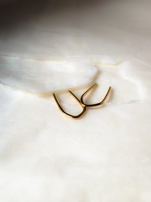 brave arc gold earrings, single or pair - andJules Jewelry